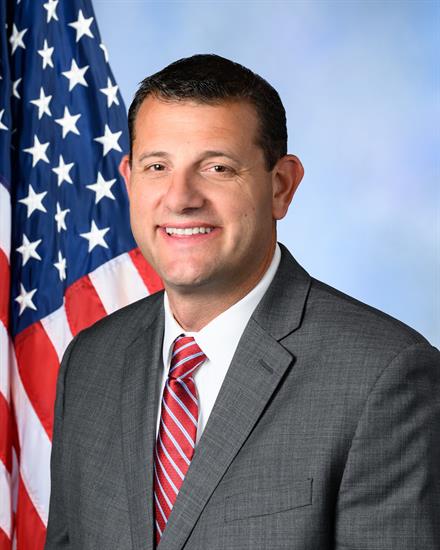 Rep. Valadao smiling in front of an American flag